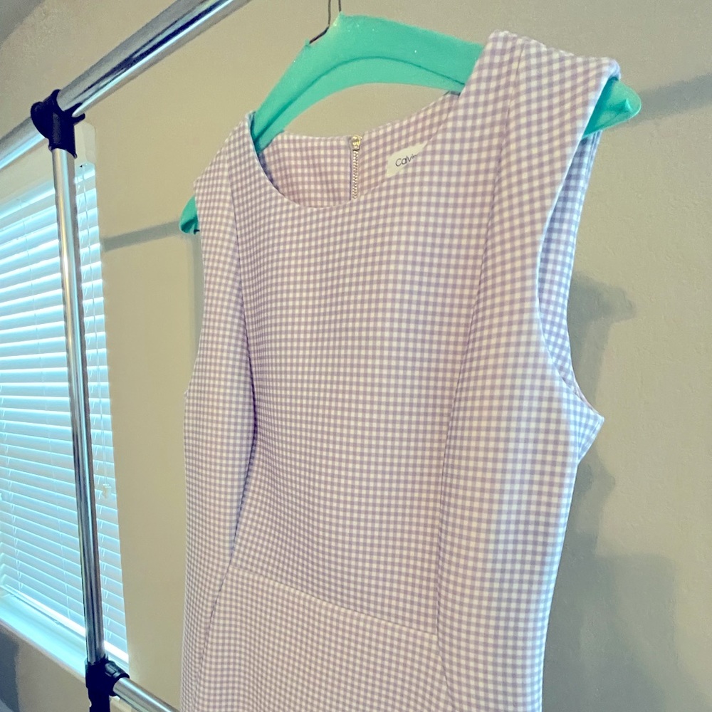 Calvin Klein size 10 purple and while dress.  Worn once and dry cleaned.